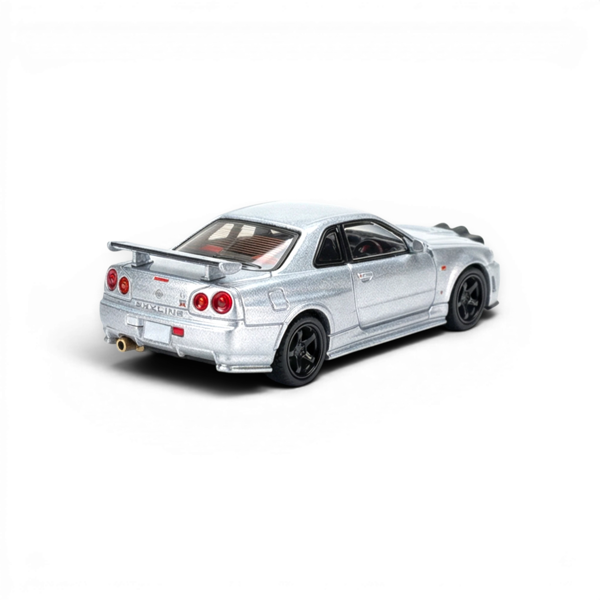 Lot57Supplies Diecast Shop silver 1:64 scale Street Weapon Nissan R34 GT-R diecast model with front snow lights.