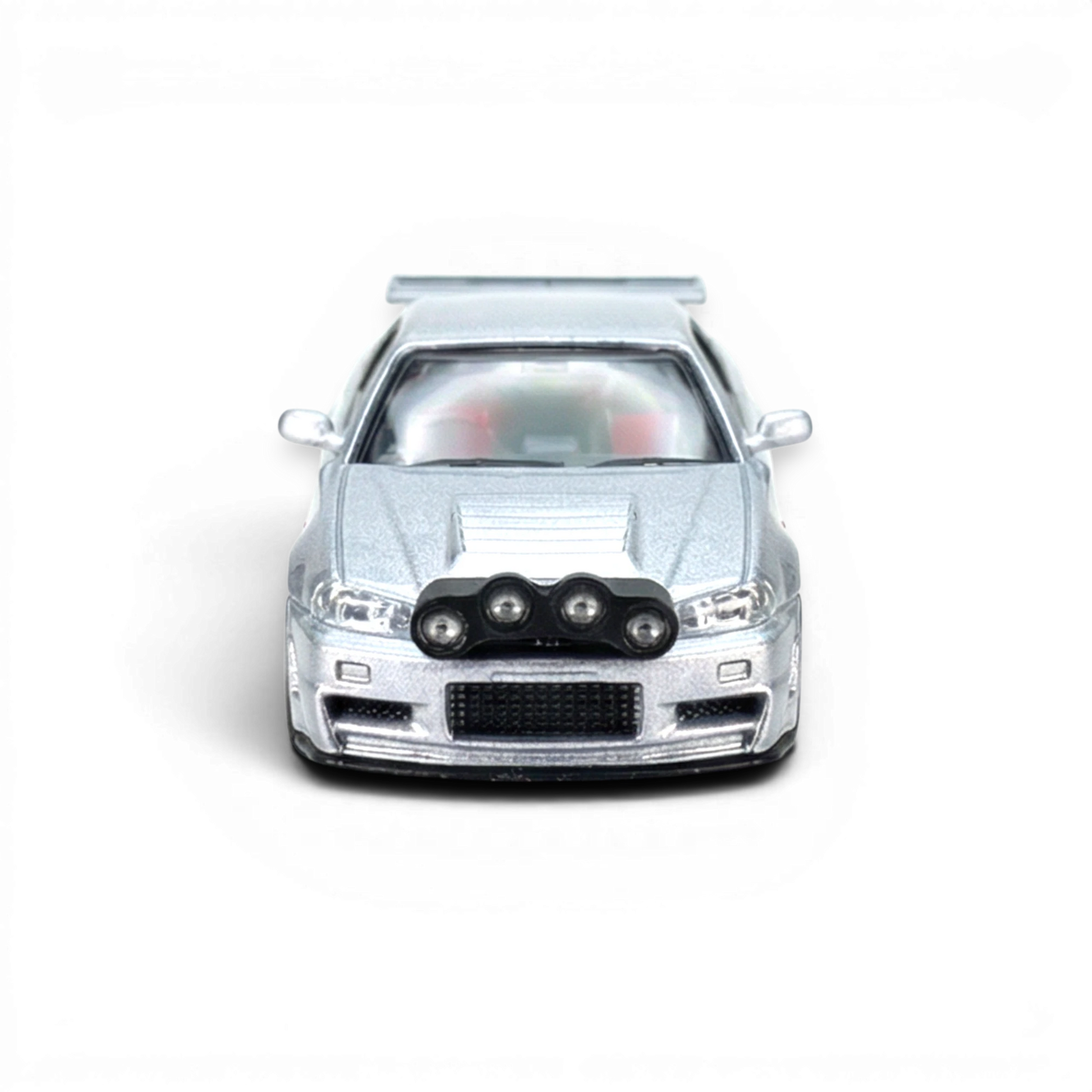 Lot57Supplies Diecast Shop silver Nissan R34 GT-R 1:64 scale model with front snow lights.