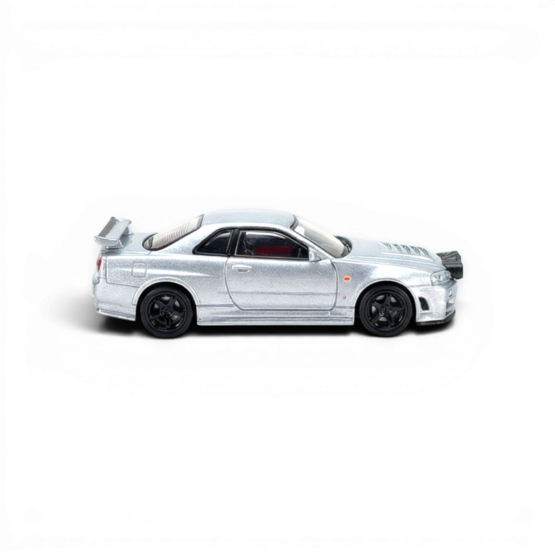 Lot57Supplies Diecast Shop silver Nissan R34 GT-R 1:64 scale diecast model with front snow lights.