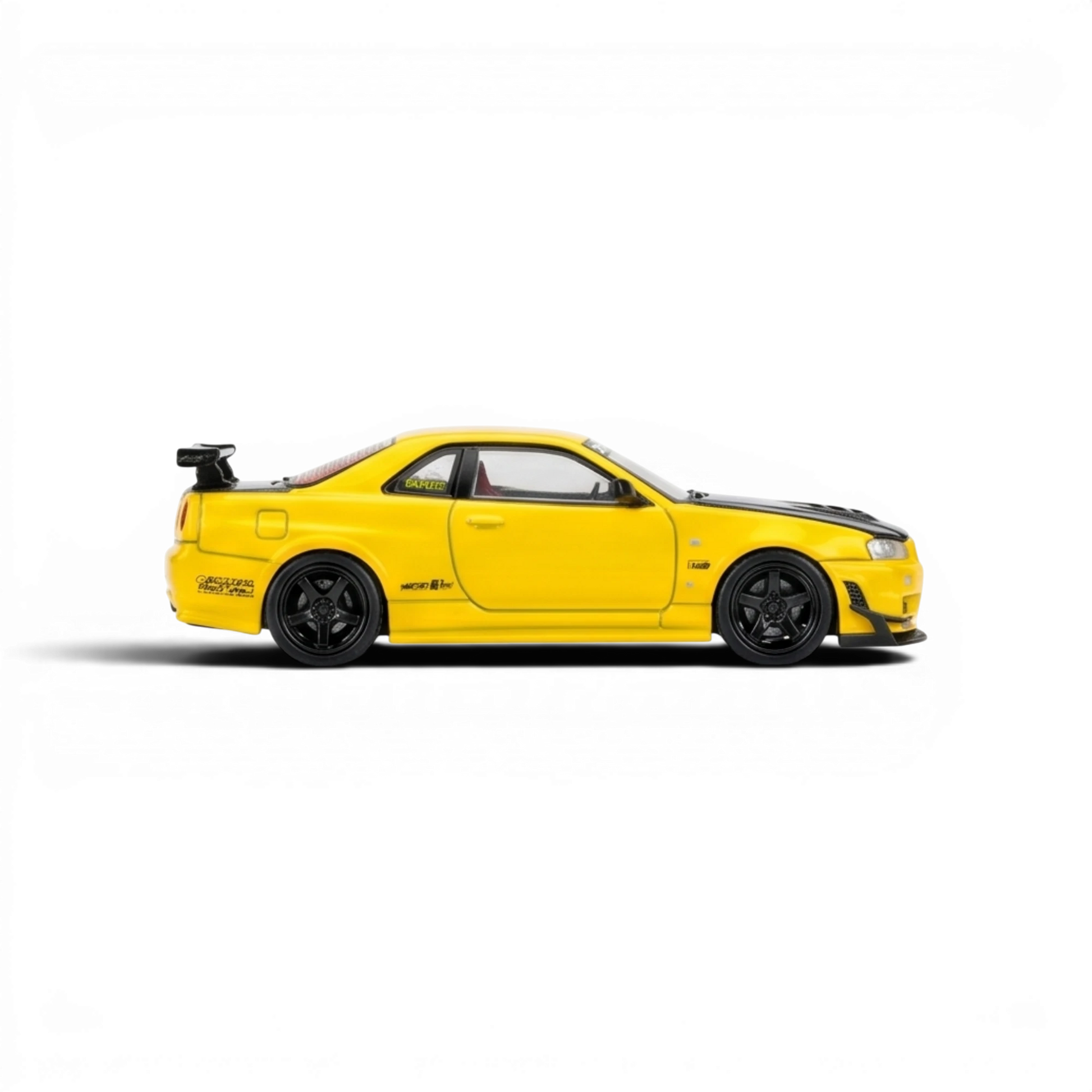 Lot57Supplies Diecast Shop 1:64 scale diecast model of a yellow Nissan Skyline GT-R R34 with GT aero kit and black hood.