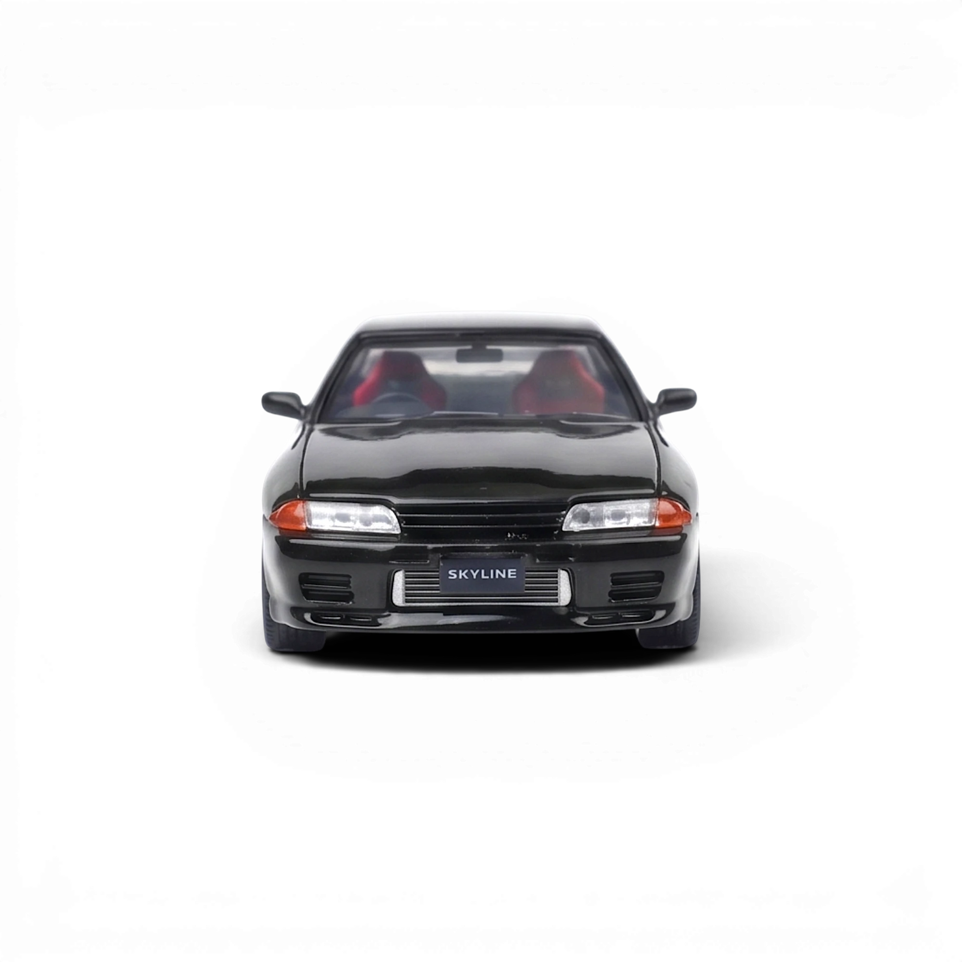 Lot57Supplies Diecast Shop Cool ART 1:64 scale Nissan Skyline GT-R R32 diecast model car with black finish.