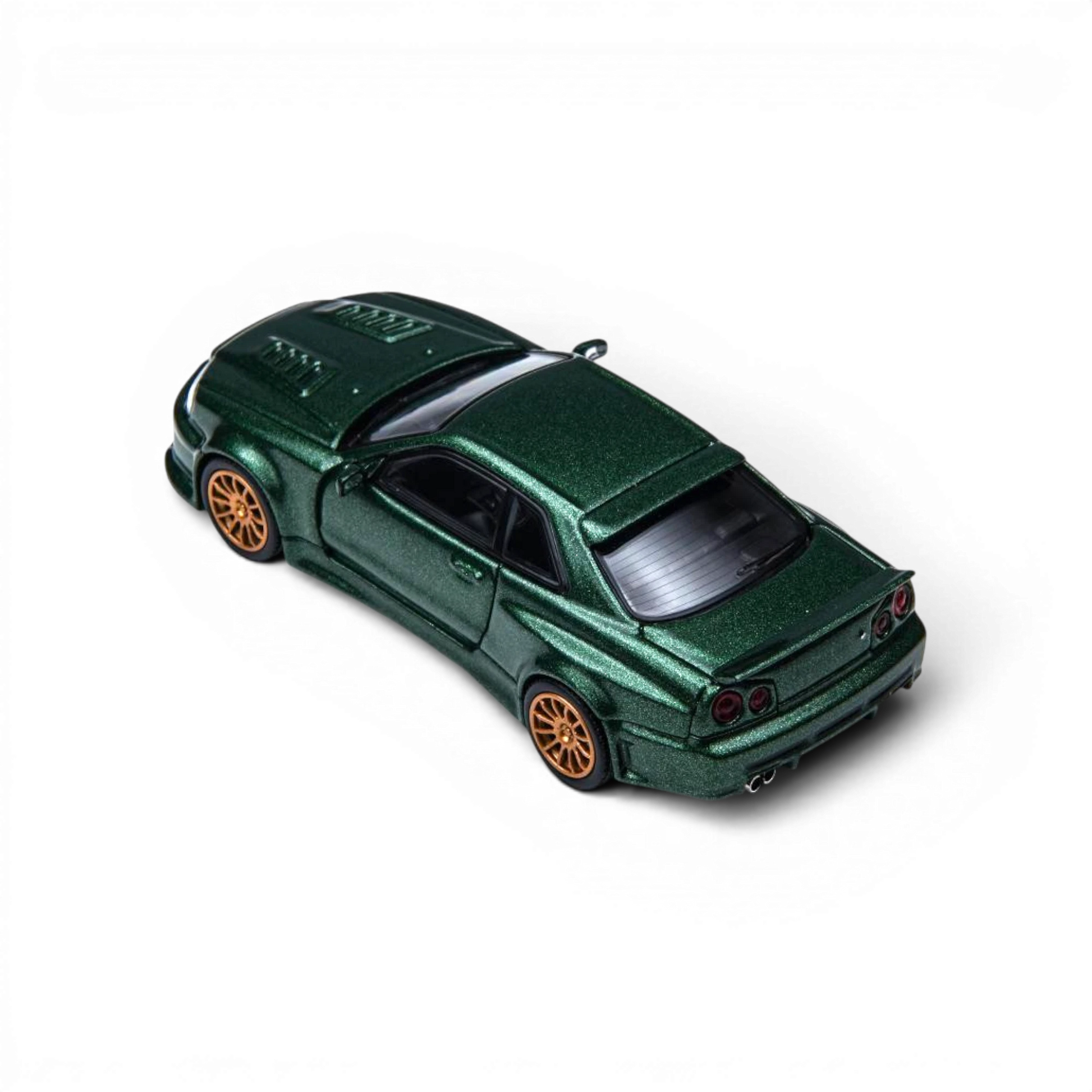Lot57Supplies Diecast Shop dark green 1:64 scale Nissan Skyline GT-R R34 Smilodon diecast model with aggressive aero.
