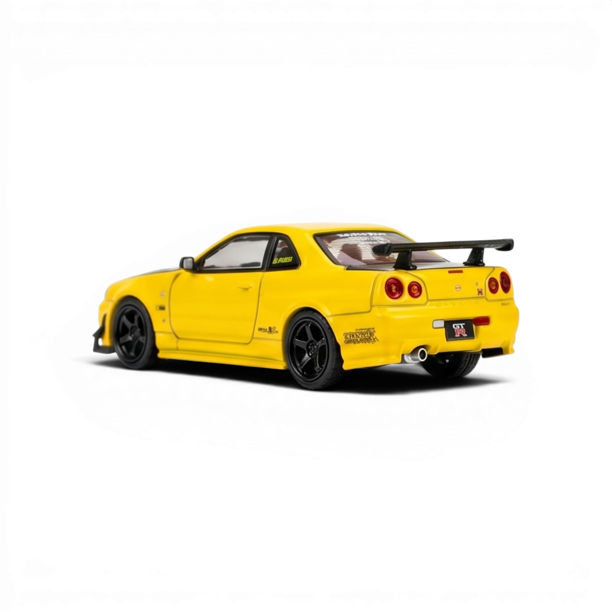 Lot57Supplies Diecast Shop lightning yellow 1:64 scale Nissan Skyline GT-R R34 customized diecast model with GT aero kit.