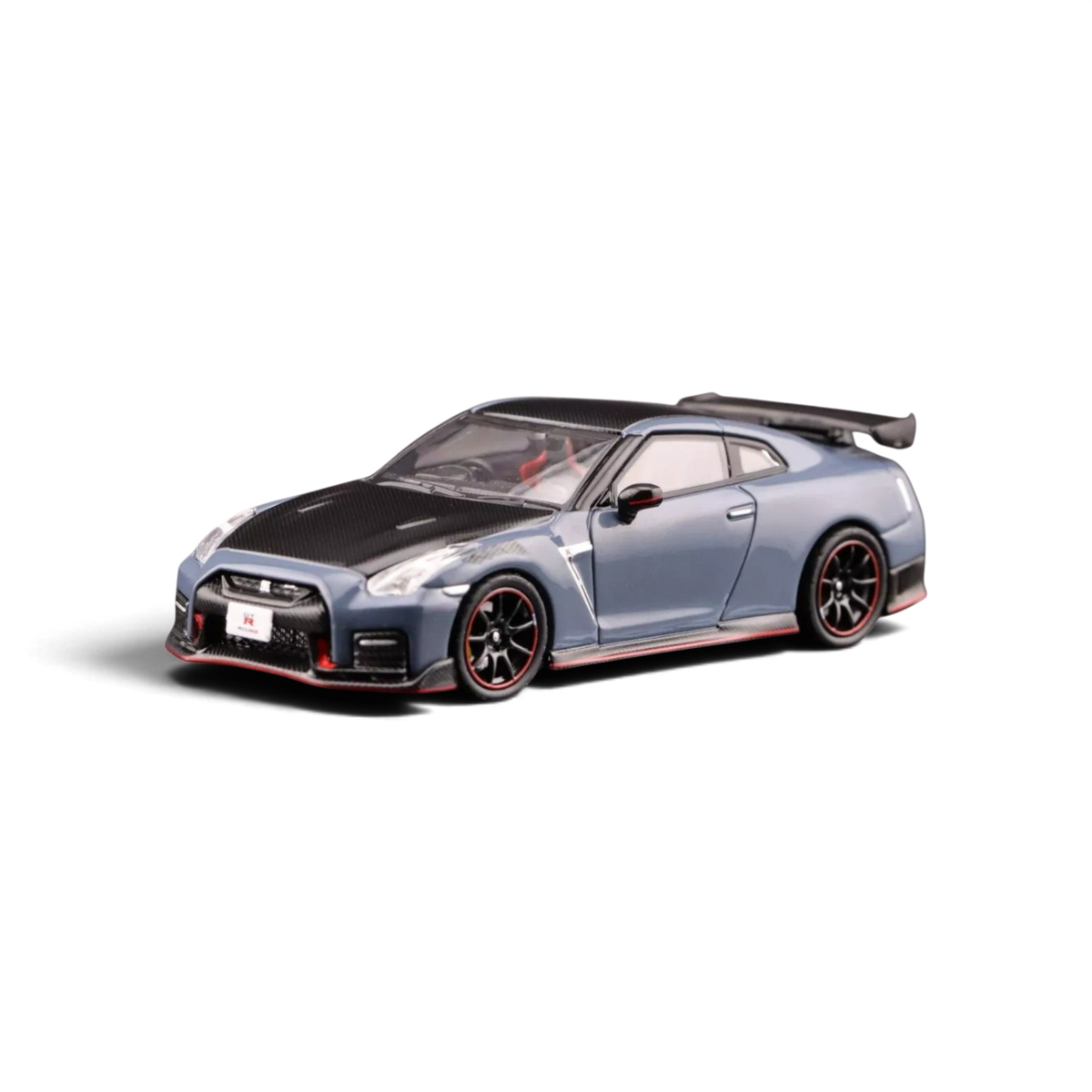Lot57Supplies Diecast Shop 1:64 scale INNO64 Nissan Skyline GT-R R35 Nismo model car in stealth gray with carbon hood.