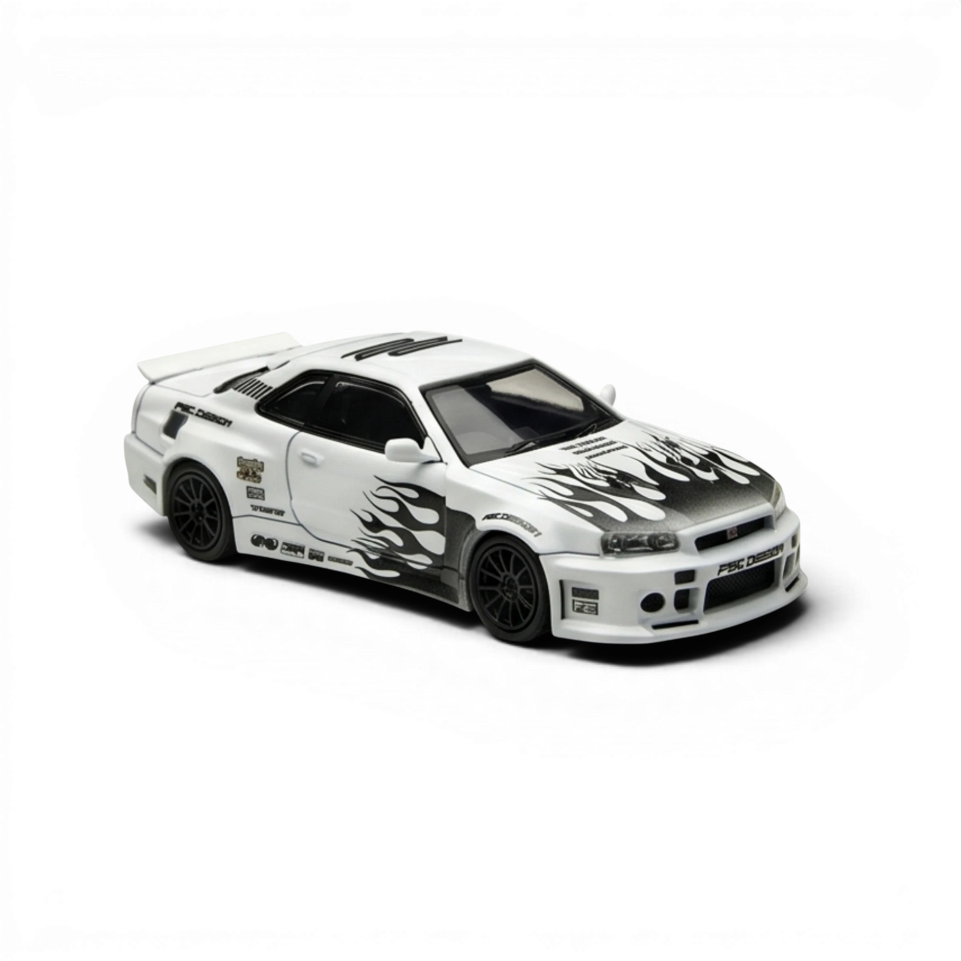 Lot57Supplies Diecast Shop white 1:64 scale Nissan Skyline R34 GT-R model with black flame graphics on hood and sides.