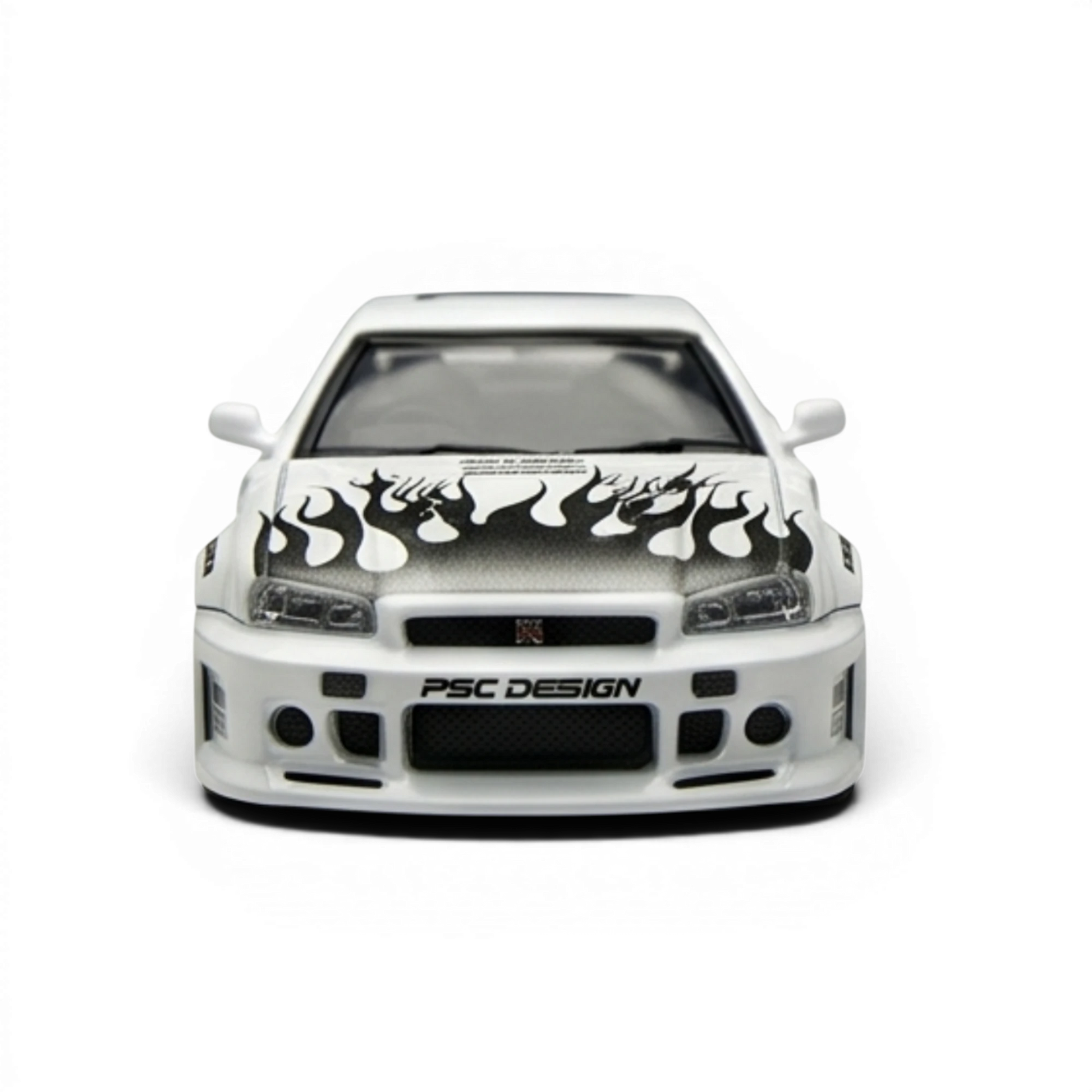 Lot57Supplies Diecast Shop white 1:64 Nissan Skyline R34 GT-R Smilodon diecast model with black flame graphics on hood.