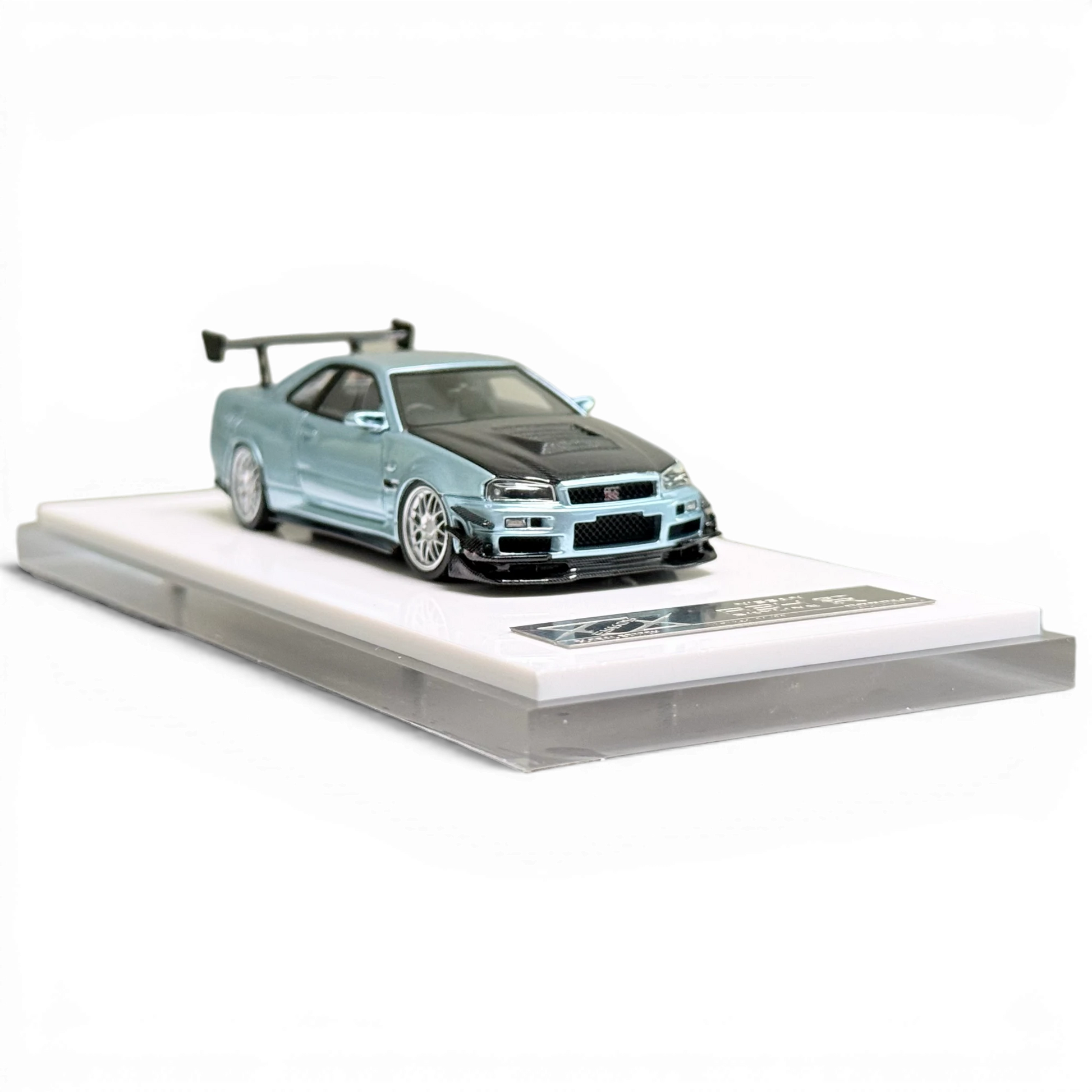 404ERROR Nissan Skyline R34 diecast model in ice blue with carbon hood from Lot57Supplies Diecast Shop, 1:64 scale.