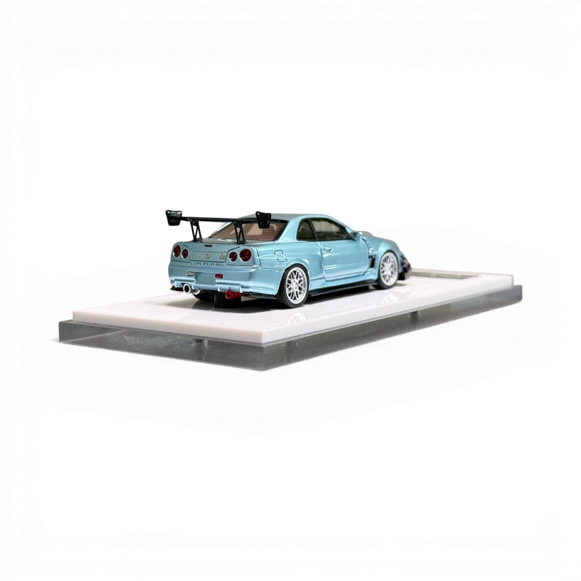 Lot57Supplies Diecast Shop 404ERROR ice blue modified Nissan Skyline R34 1:64 scale diecast model on display stand