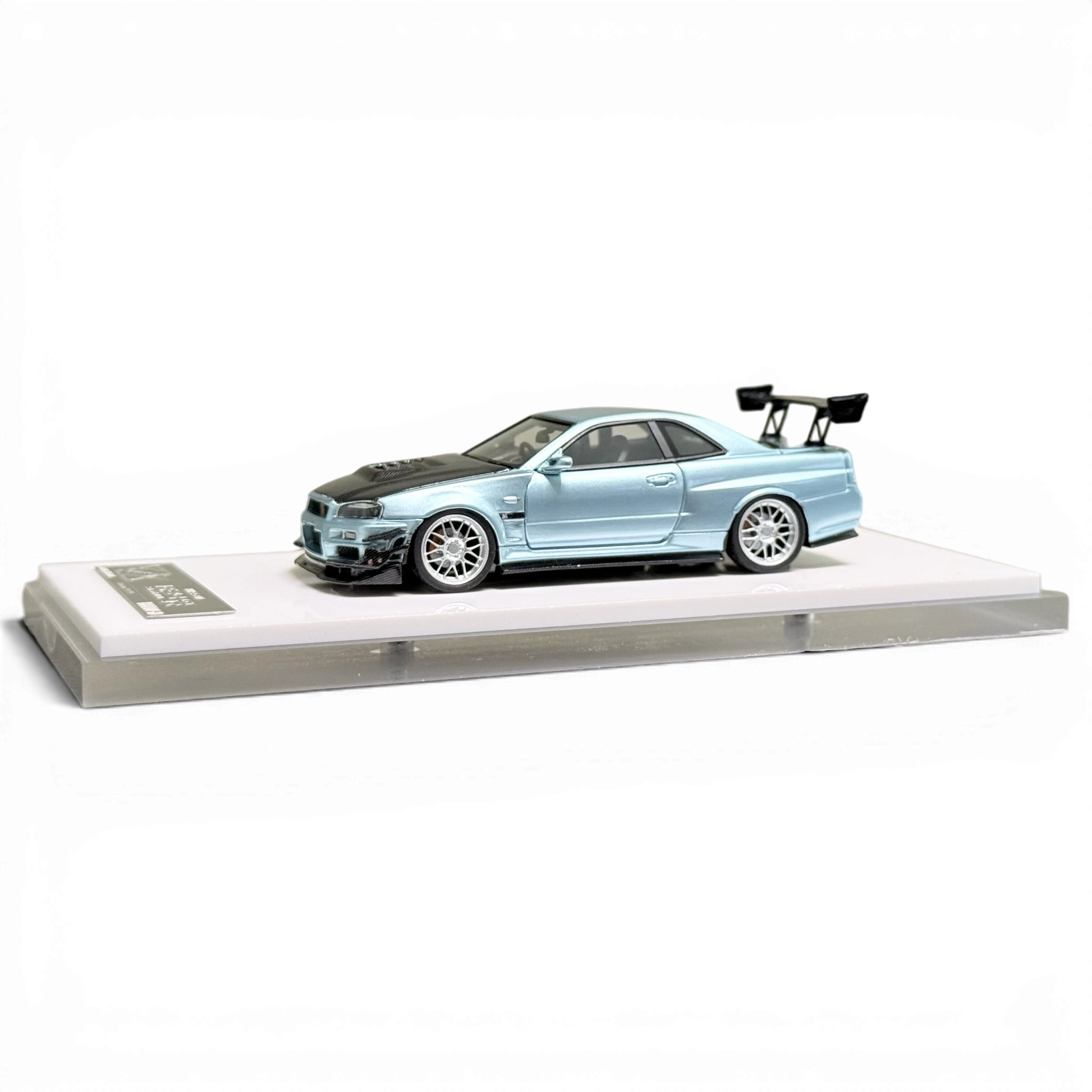 Lot57Supplies Diecast Shop 404ERROR 1:64 scale Nissan Skyline R34 modified diecast car in ice blue with carbon hood