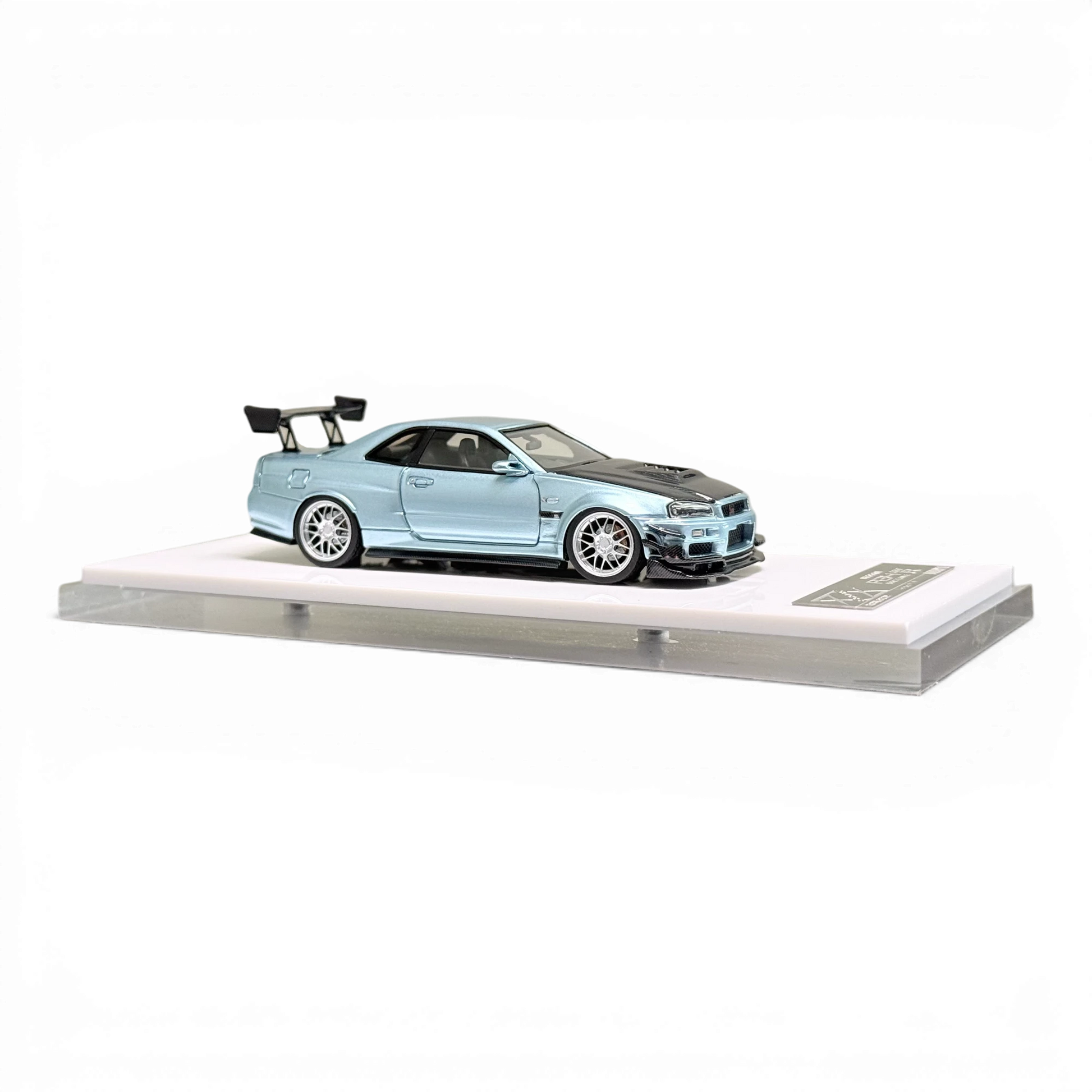 404ERROR Nissan Skyline R34 diecast model in ice blue with carbon hood, sold by Lot57Supplies Diecast Shop.