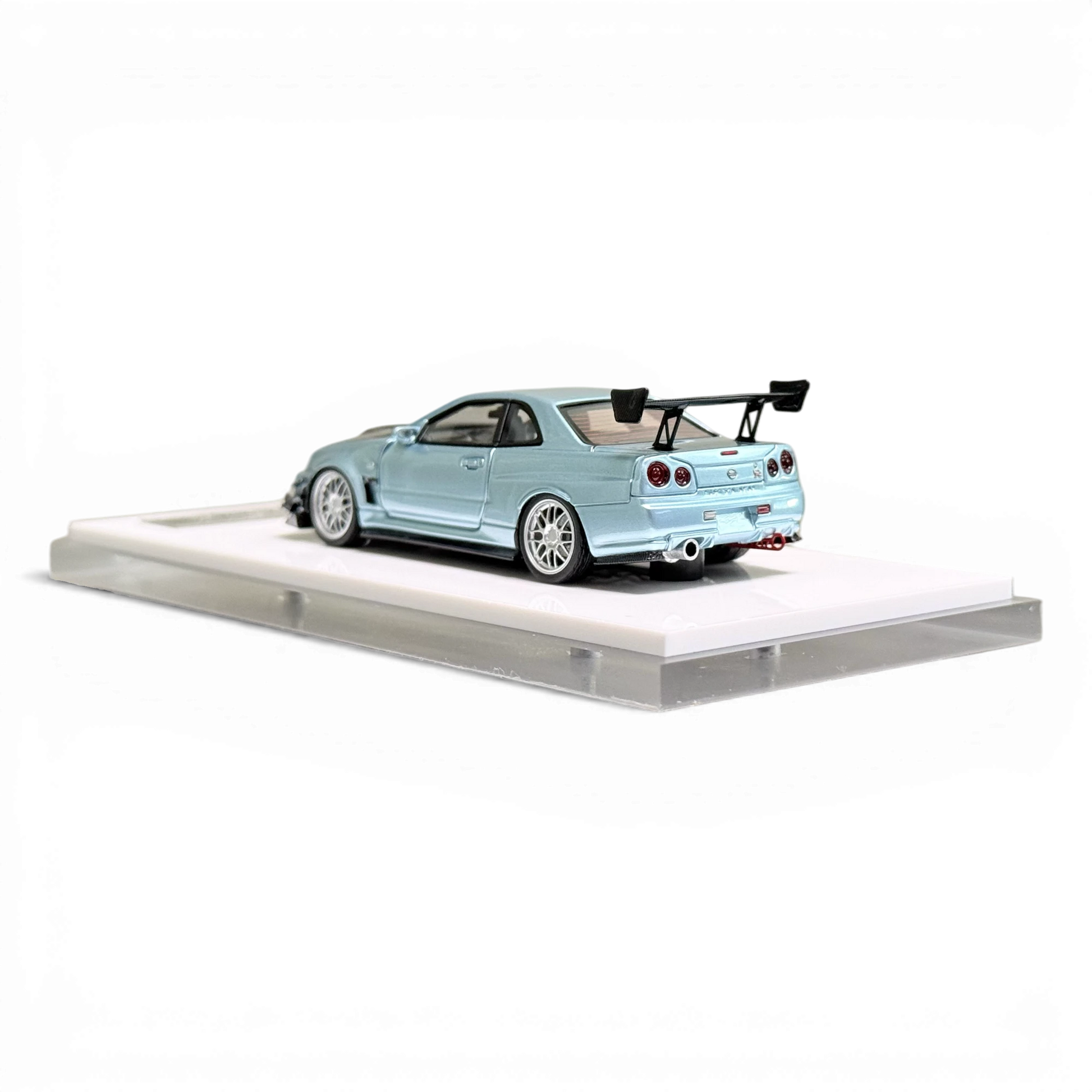 Lot57Supplies Diecast Shop 404ERROR 1:64 scale Nissan Skyline R34 diecast model in ice blue with carbon hood.