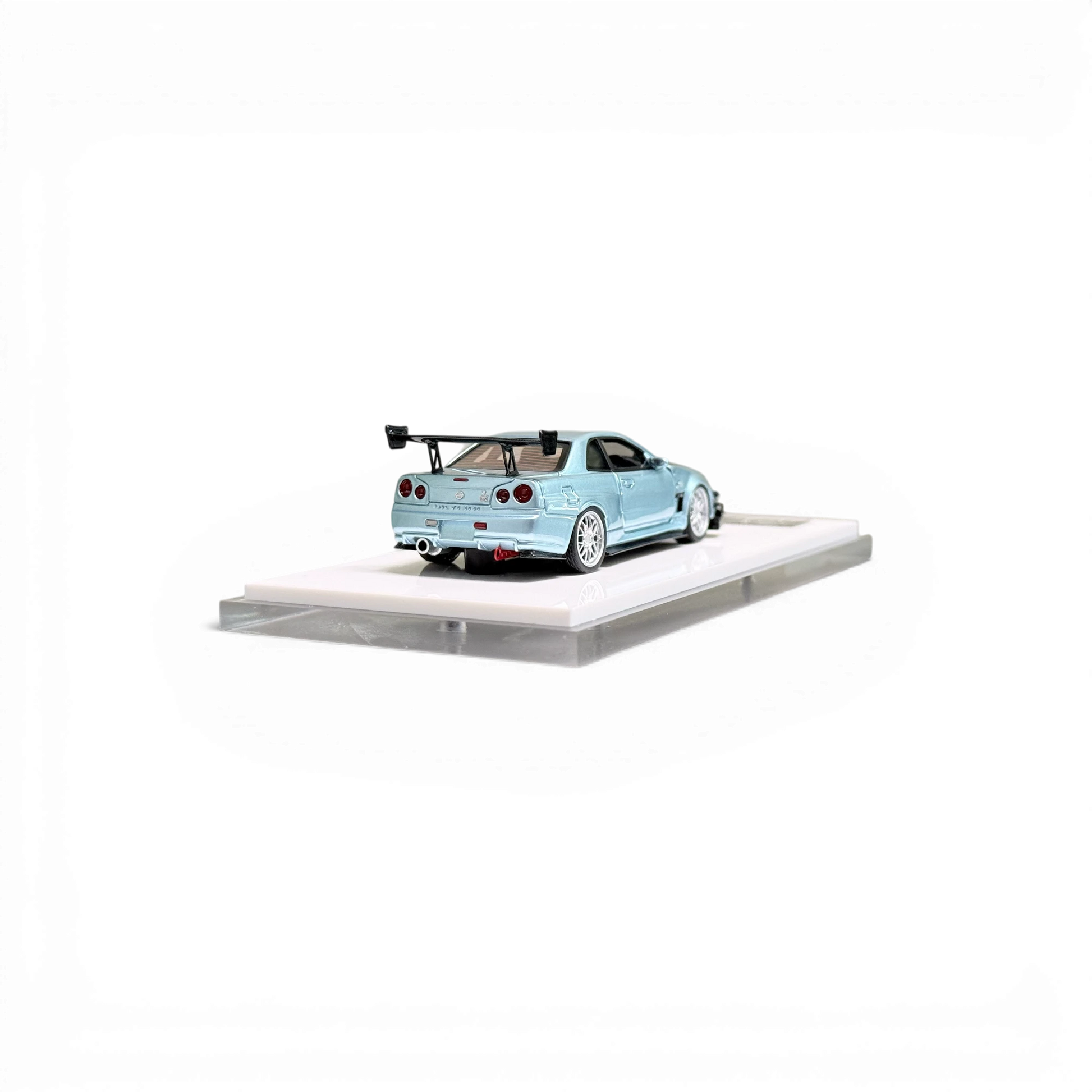 Lot57Supplies Diecast Shop 404ERROR Nissan Skyline R34 diecast model in ice blue with carbon hood, 1:64 scale.