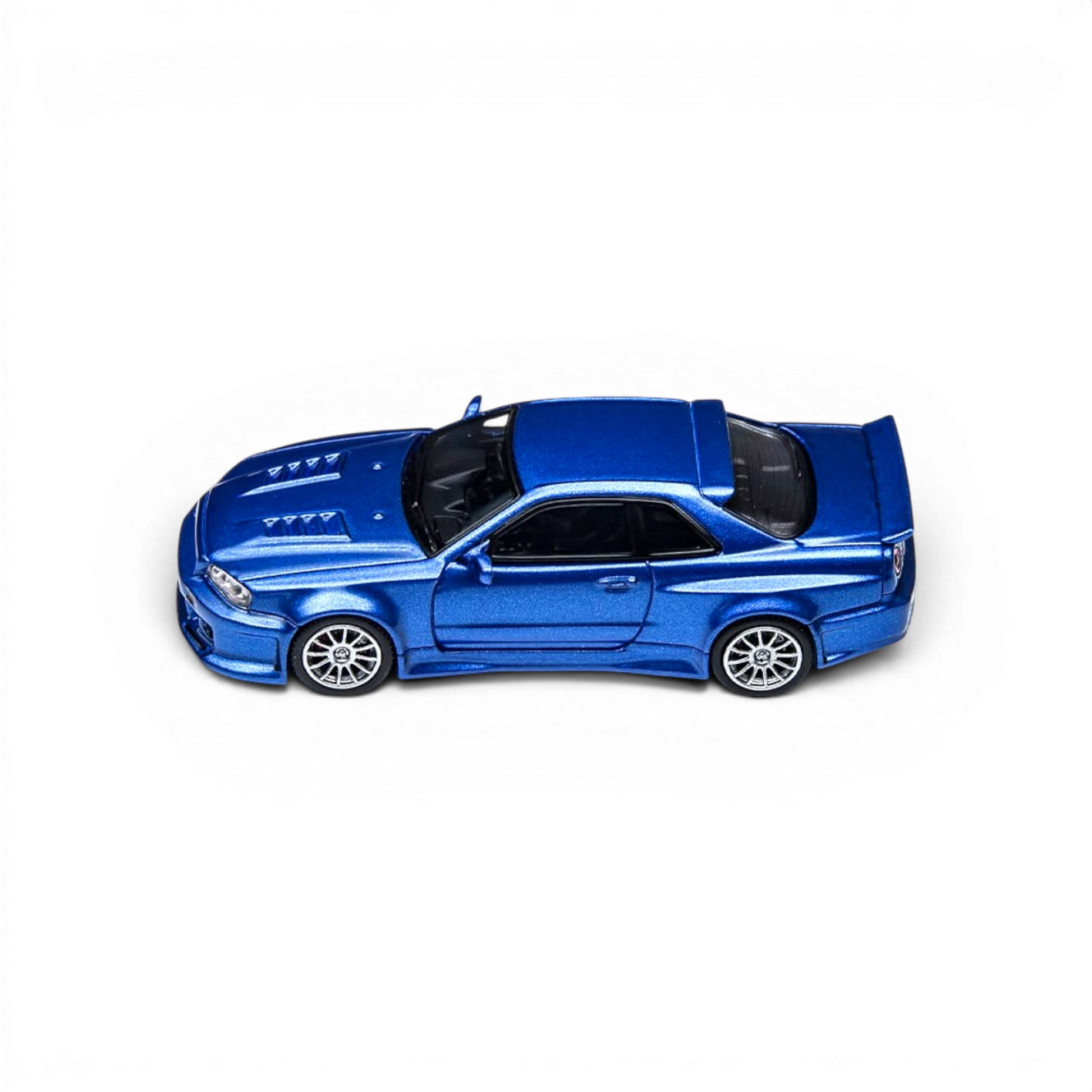 Lot57Supplies Diecast Shop 1:64 scale navy blue Nissan Skyline GT-R R34 Smilodon diecast model car, top view.