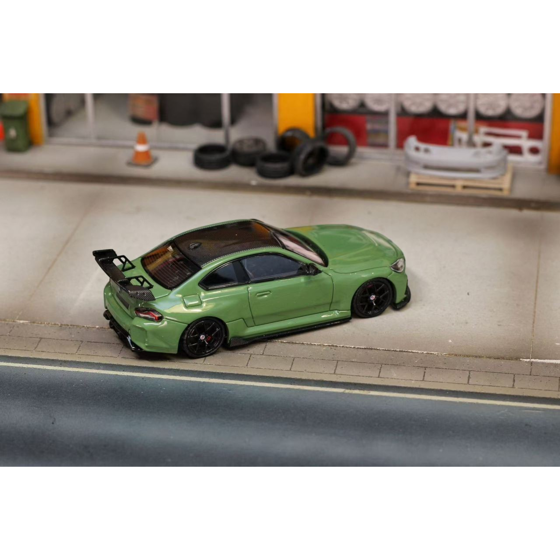 Lot57Supplies Diecast Shop 1:64 scale SW G87 M2 ADRO modified diecast car in olive green with a large rear wing