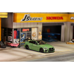Lot57Supplies Diecast Shop 1:64 scale olive green SW G87 M2 ADRO modified diecast car with high wing on display