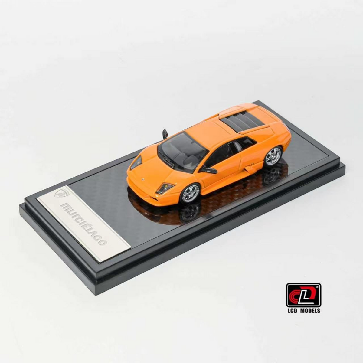 Lot57Supplies Diecast Shop 1:64 scale orange LCD Lamborghini Murciélago diecast model car on a display base