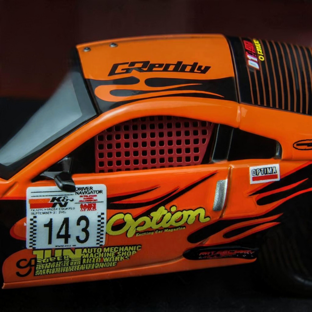 Lot57Supplies Diecast Shop 1:64 scale orange Nissan Fairlady Z Z33 Option Stream Z diecast model with racing decals