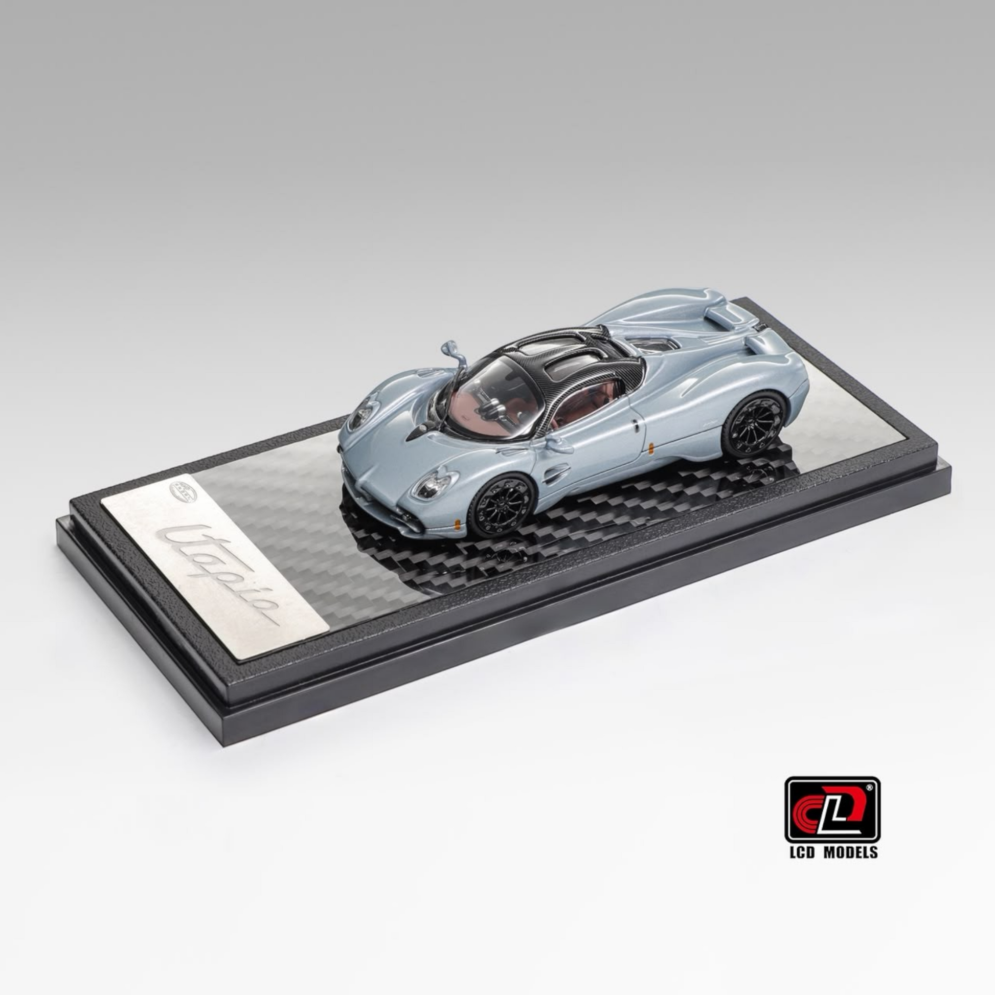 Lot57Supplies Diecast Shop LCD Pagani Utopia 1:64 scale diecast model car in ice blue with carbon fiber base