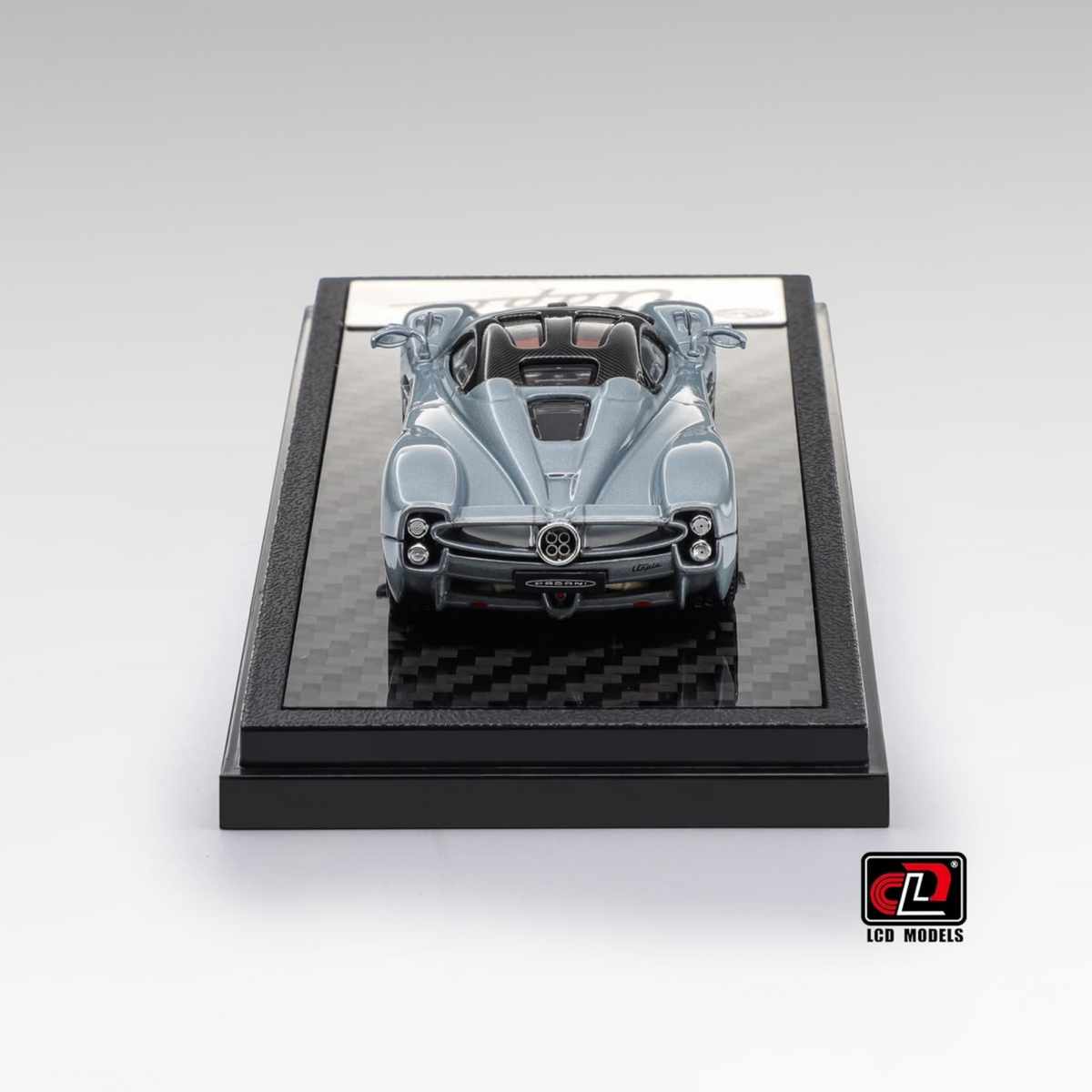Lot57Supplies Diecast Shop LCD Pagani Utopia 1:64 scale diecast model car in ice blue, rear view on display base.