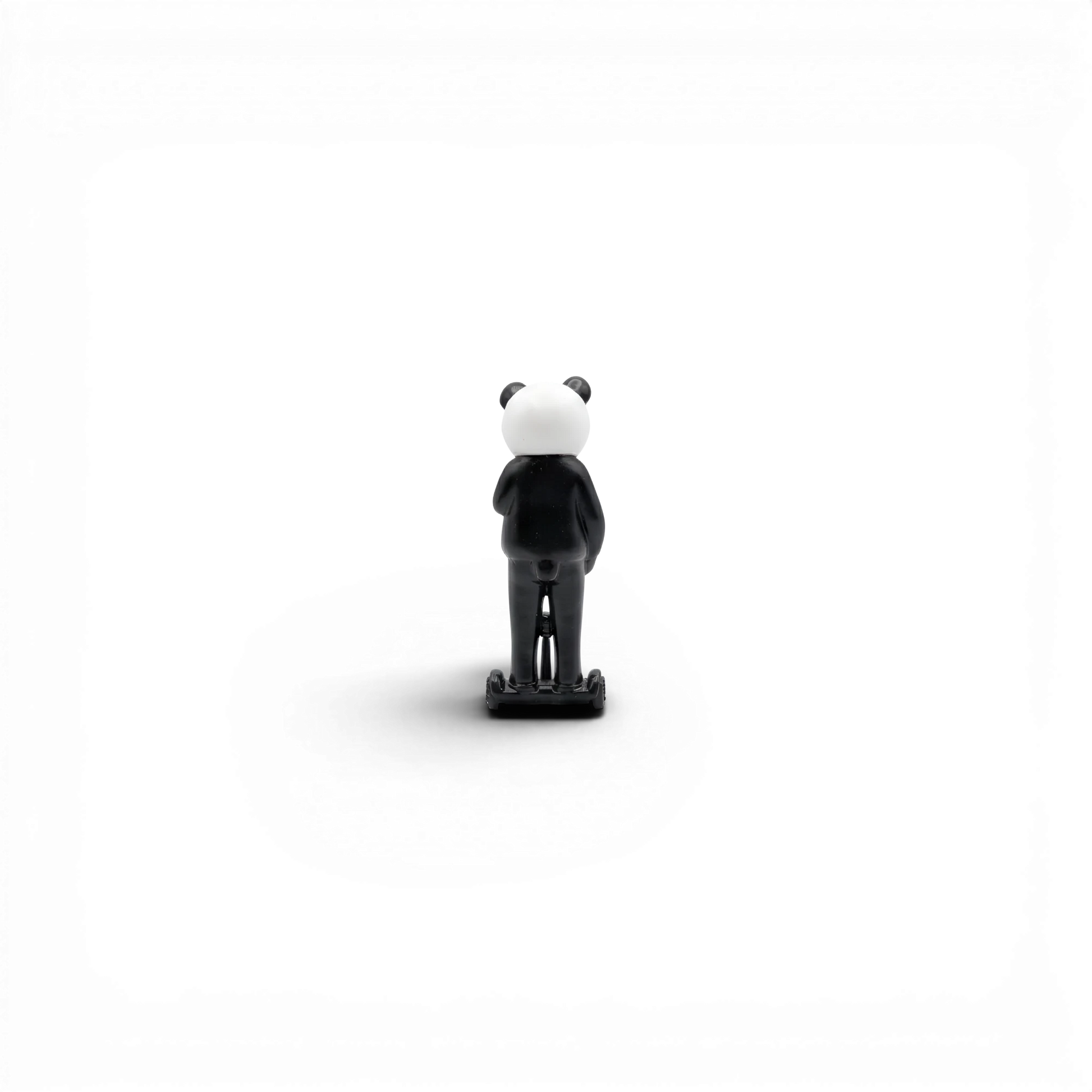 Lot57Supplies Diecast Shop Street Weapon 1:64 scale resin panda figure standing on a hoverboard, rear view.