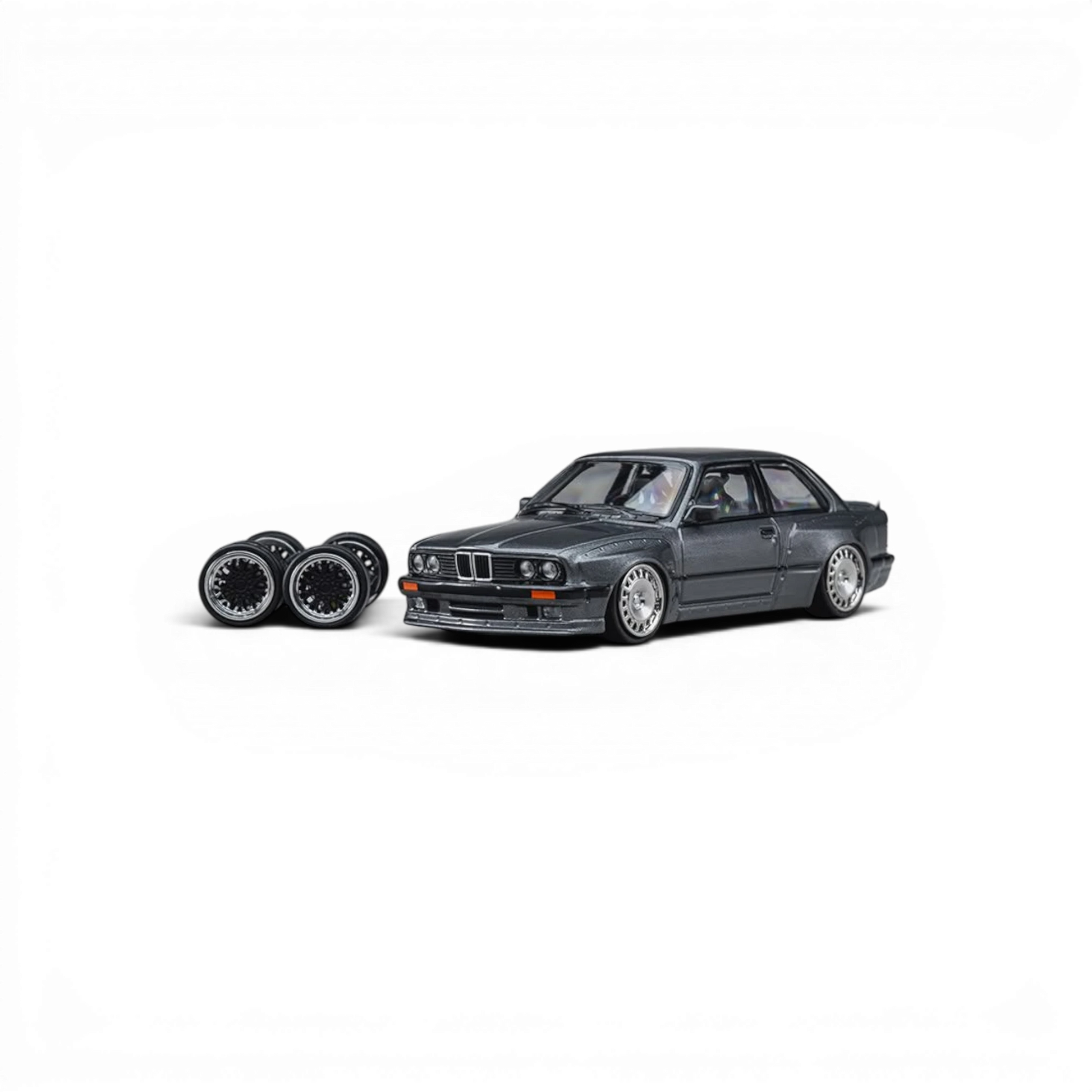 Lot57Supplies Diecast Shop 1:64 scale CM Model Pandem M3 E30 diecast car in metallic gunmetal gray with spare wheels