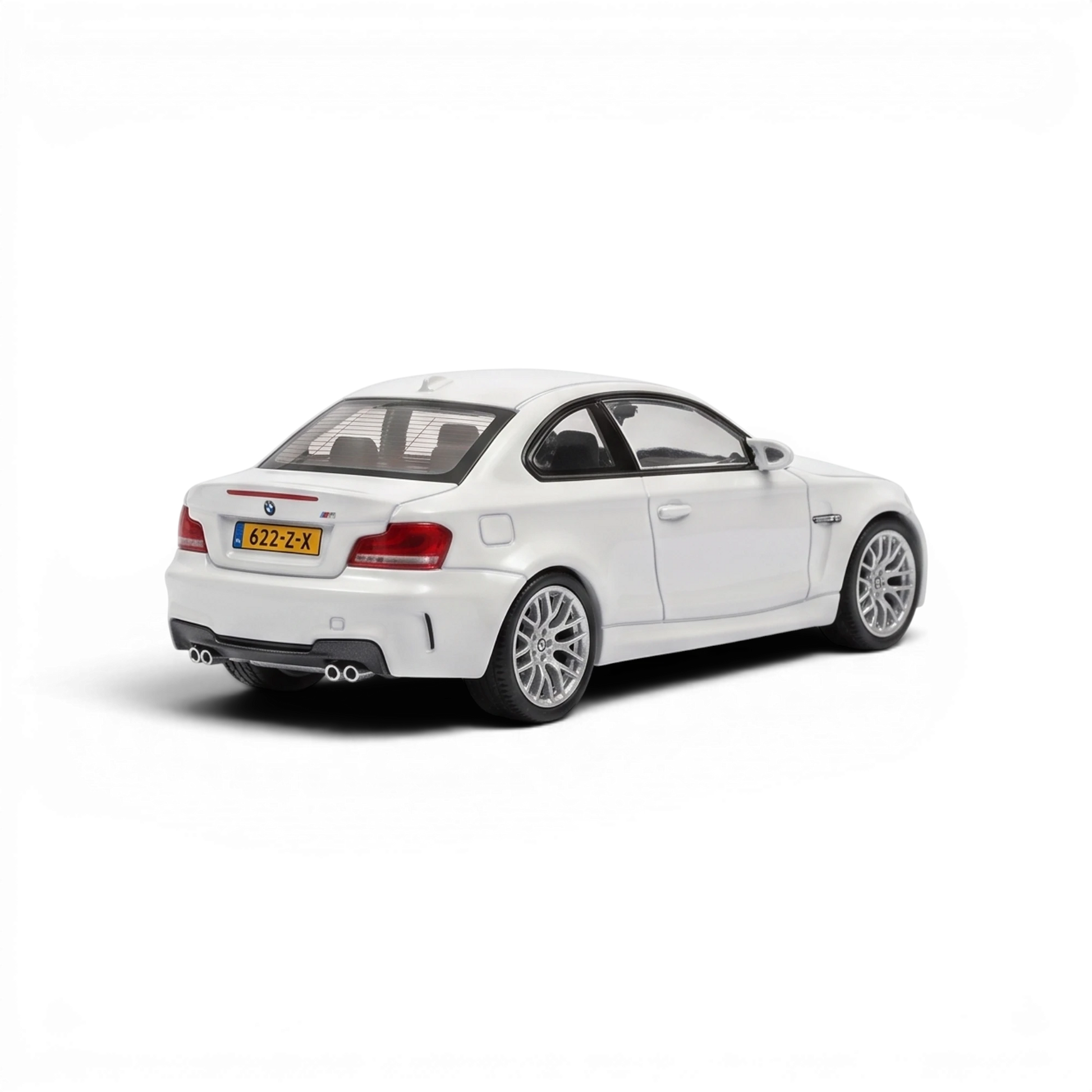 Lot57Supplies Diecast Shop MORTAL 1:64 scale pearl white BMW 1M Coupe diecast model car, rear three-quarter view.
