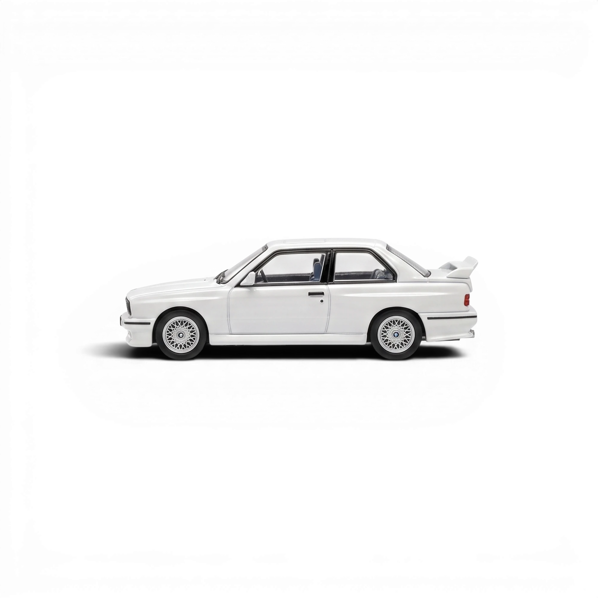 Lot57Supplies Diecast Shop Mortal 1:64 scale pearl white BMW E30 M3 diecast model car, side profile view.
