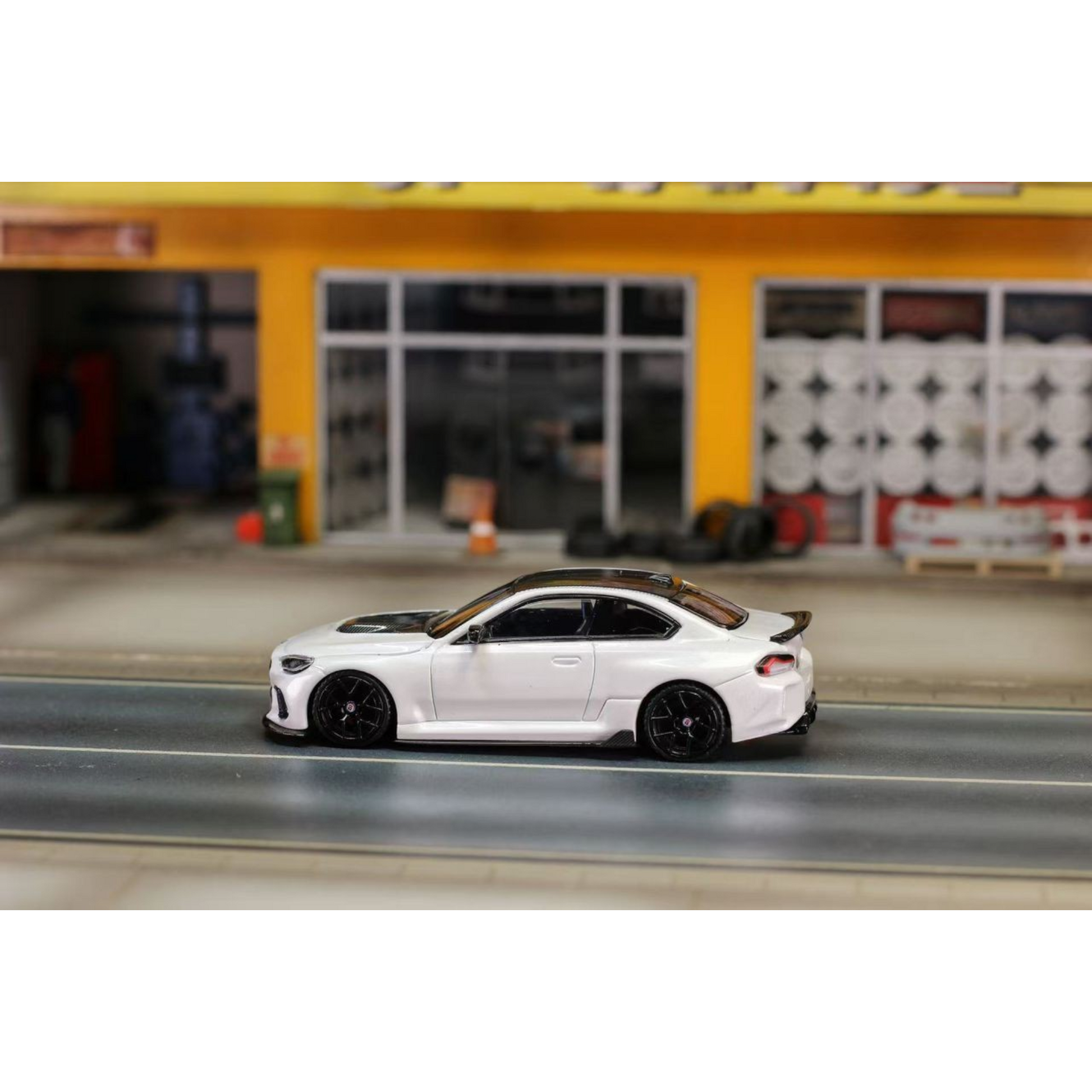 Lot57Supplies Diecast Shop 1:64 scale pearl white SW G87 M2 ADRO modified diecast car with low wing and black wheels