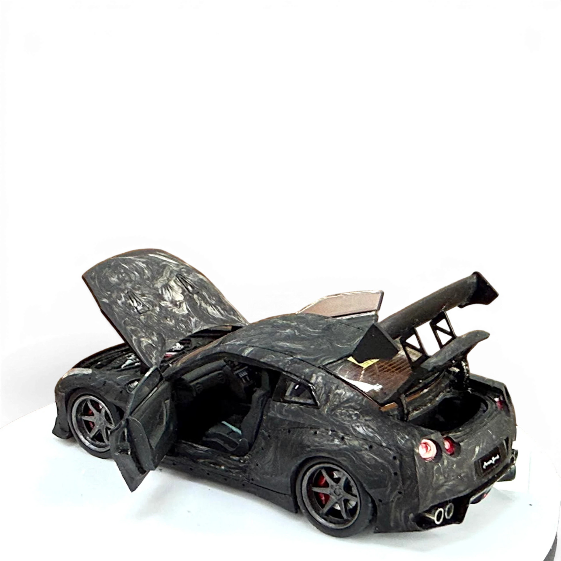Lot57Supplies Diecast Shop PGM 1:64 scale GTR R35 diecast model car in black carbon fiber with opening doors and hood