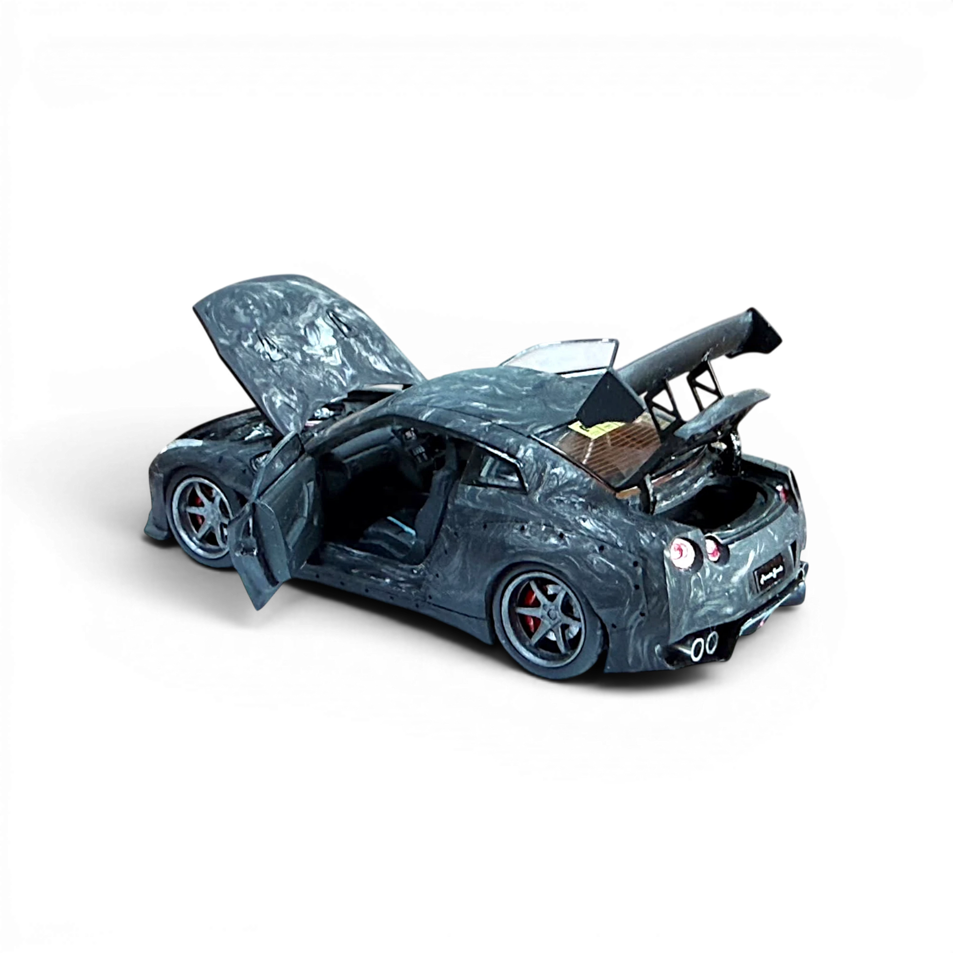 Lot57Supplies Diecast Shop PGM 1:64 scale GTR R35 diecast model car in black carbon fiber with opening doors and hood