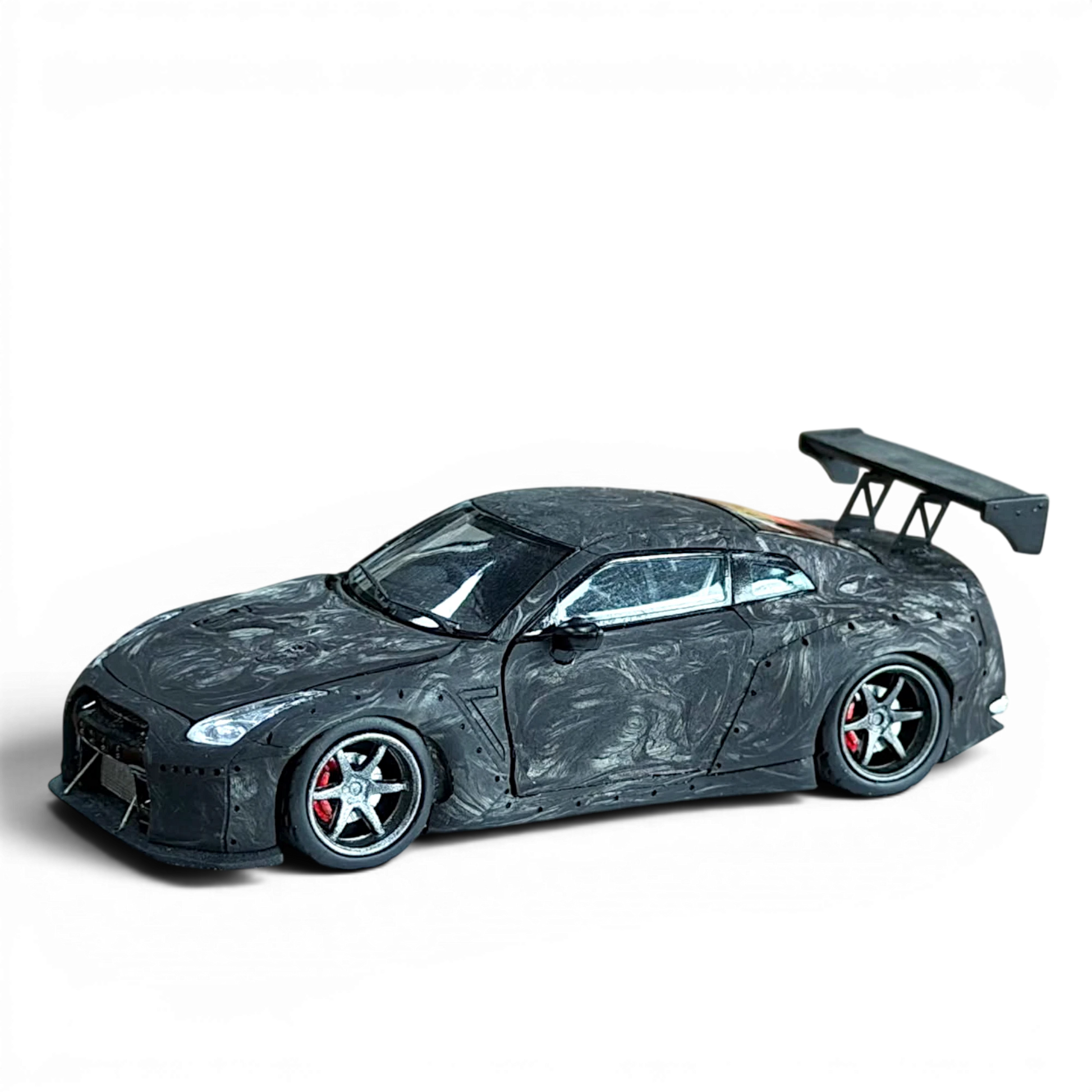 Lot57Supplies Diecast Shop PGM 1:64 scale GTR R35 model car in black carbon fiber finish with rear spoiler