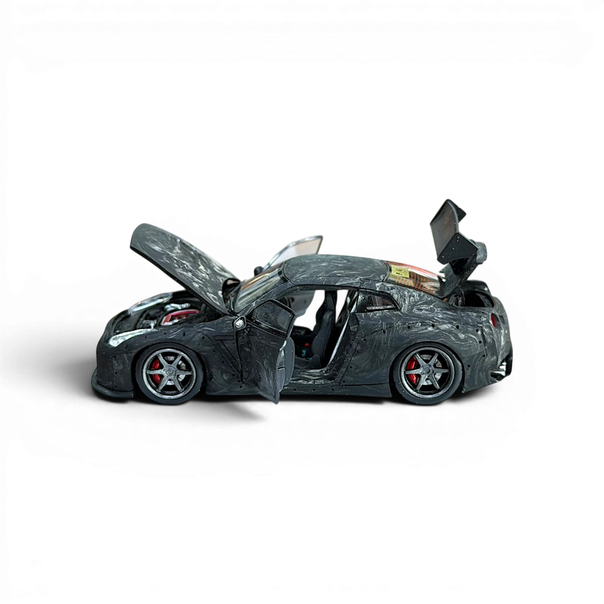 Lot57Supplies Diecast Shop PGM 1:64 scale GTR R35 diecast model car in black carbon fiber with opening doors and hood