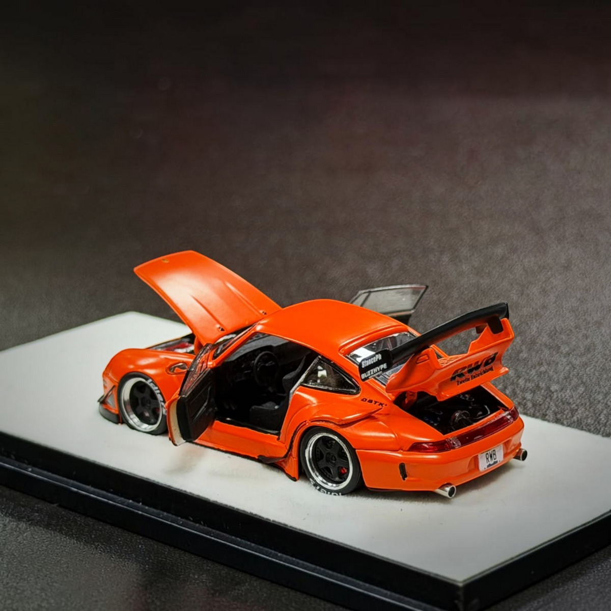 Lot57Supplies Diecast Shop 1:64 scale PGM RWB 993 diecast model car in matte orange with opening doors and engine bay
