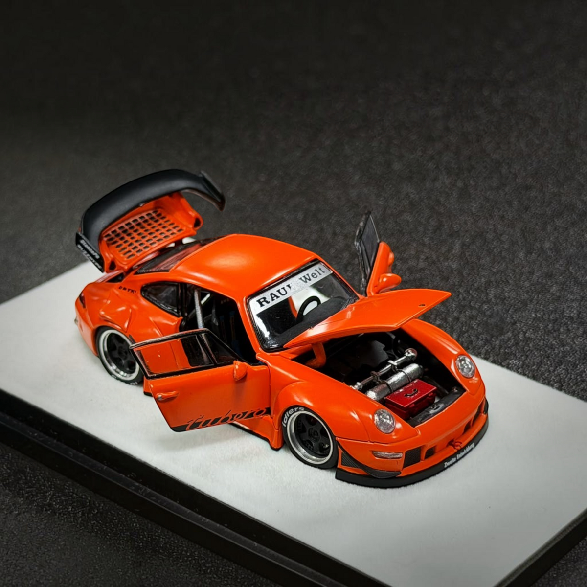 Lot57Supplies Diecast Shop 1:64 scale matte orange PGM RWB 993 diecast model car with opening doors and engine hood.