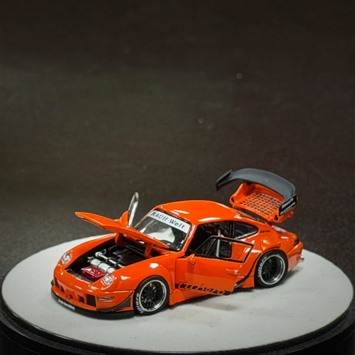 Lot57Supplies Diecast Shop PGM RWB 993 diecast model car in bright orange with open hood and engine detail