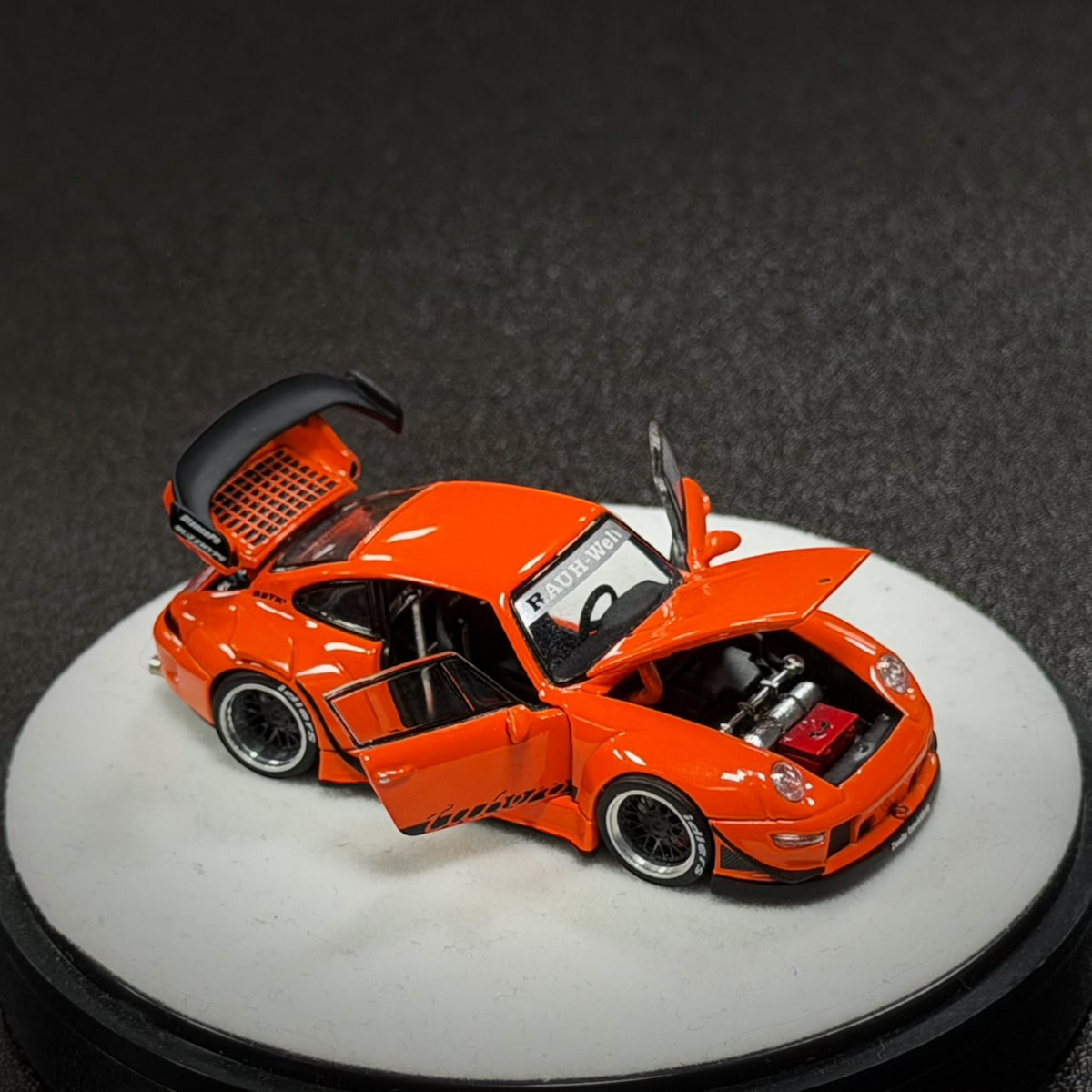 Lot57Supplies Diecast Shop PGM RWB 993 diecast model car in bright thermal orange with opening doors and engine bay
