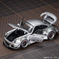 Lot57Supplies Diecast Shop PGM RWB930 silver diecast model car with opening doors and engine hood on cutting mat