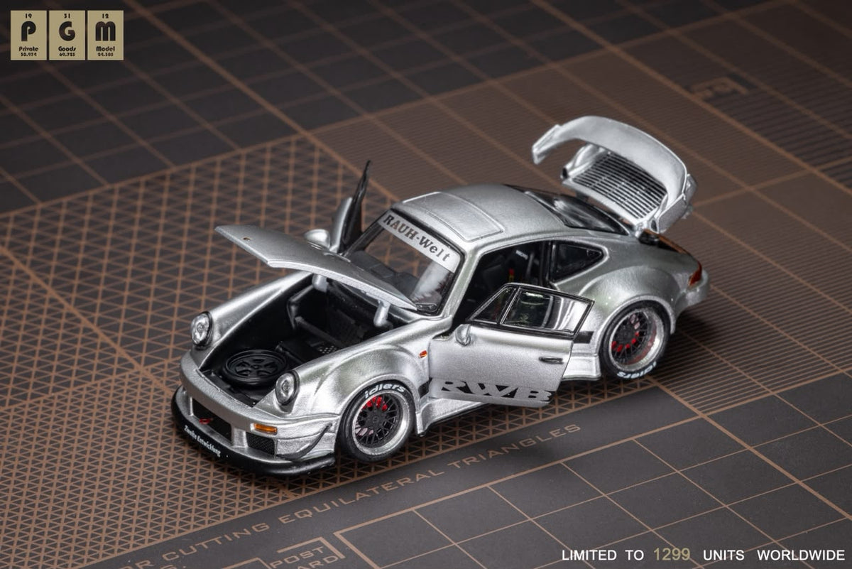 Lot57Supplies Diecast Shop PGM RWB930 silver diecast model car with opening doors and engine hood on cutting mat