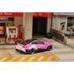 Lot57Supplies Diecast Shop 1:64 scale SW G82 M4 diecast car in pink Bull livery parked in a miniature garage setting.