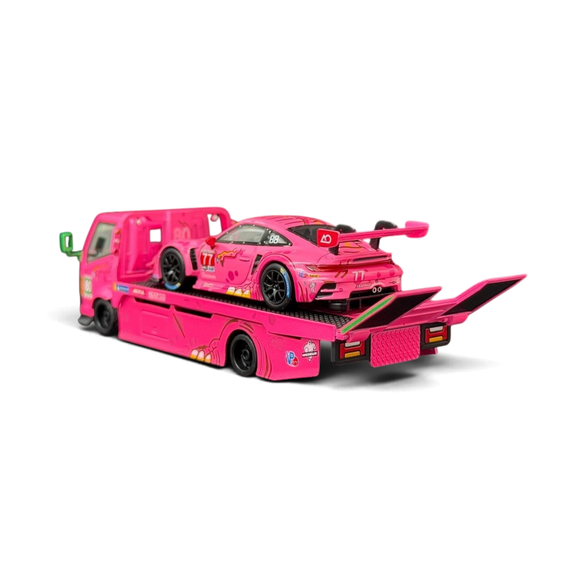 Lot57Supplies Diecast Shop 1:64 scale pink Hino 300 Dino hauler truck carrying a pink Porsche 911 GT3 R race car