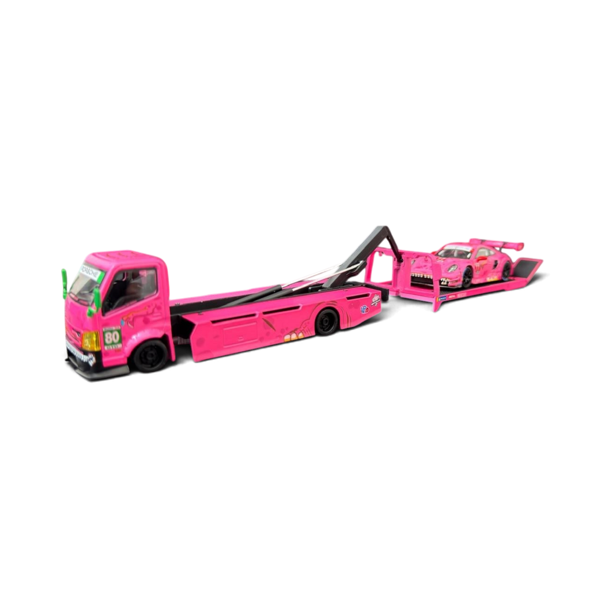 Lot57Supplies Diecast Shop 1:64 scale pink Hino 300 Dino hauler truck carrying a Mini GT Porsche 911 GT3 R ROXY car
