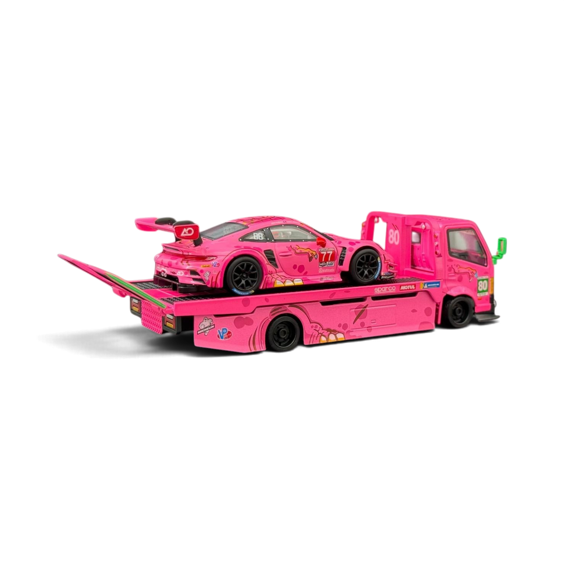 Lot57Supplies Diecast Shop 1:64 scale pink Hino 300 Dino hauler truck carrying a pink Porsche 911 GT3 R ROXY race car.