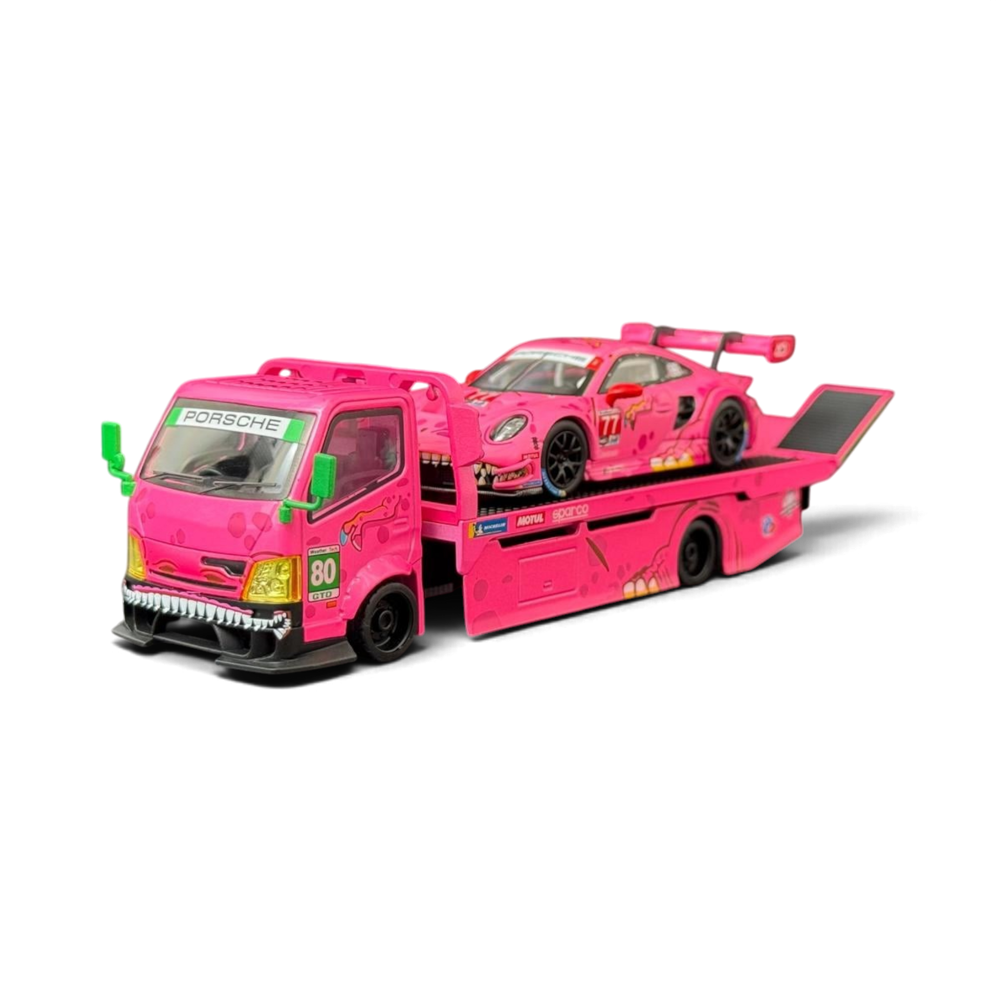 Lot57Supplies Diecast Shop 1:64 scale pink Hino 300 dino hauler truck carrying a matching pink Porsche 911 GT3 R car.