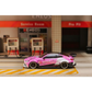 Lot57Supplies Diecast Shop 1:64 scale SW G82 M4 diecast car in pink Bull livery parked at a miniature gas station