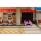 Lot57Supplies Diecast Shop 1:64 scale SW G82 M4 diecast car in pink Bull livery parked at a miniature gas station