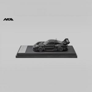 Lot57Supplies Diecast Shop HKM Porsche 911 992 GT3 R Rennsport diecast model car in gloss black on a display stand