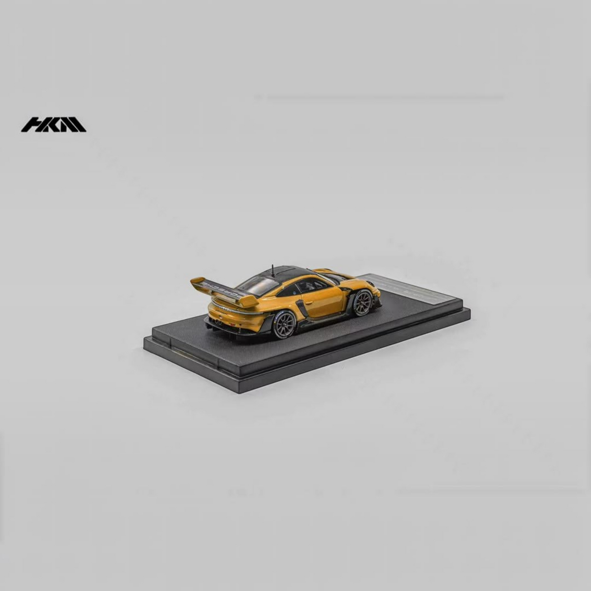 Lot57Supplies Diecast Shop HKM Porsche 911 GT3 R Rennsport diecast model in signal orange on a display base