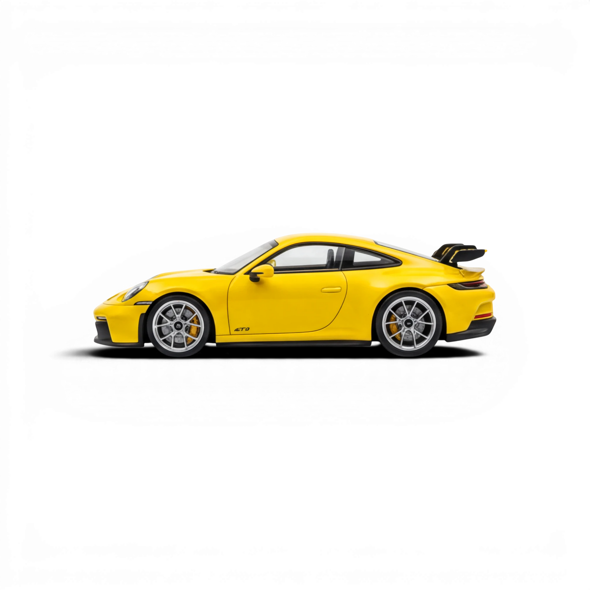 Lot57Supplies Diecast Shop yellow 1:64 scale resin Porsche 911 GT3 model with detailed wheels and spoiler.