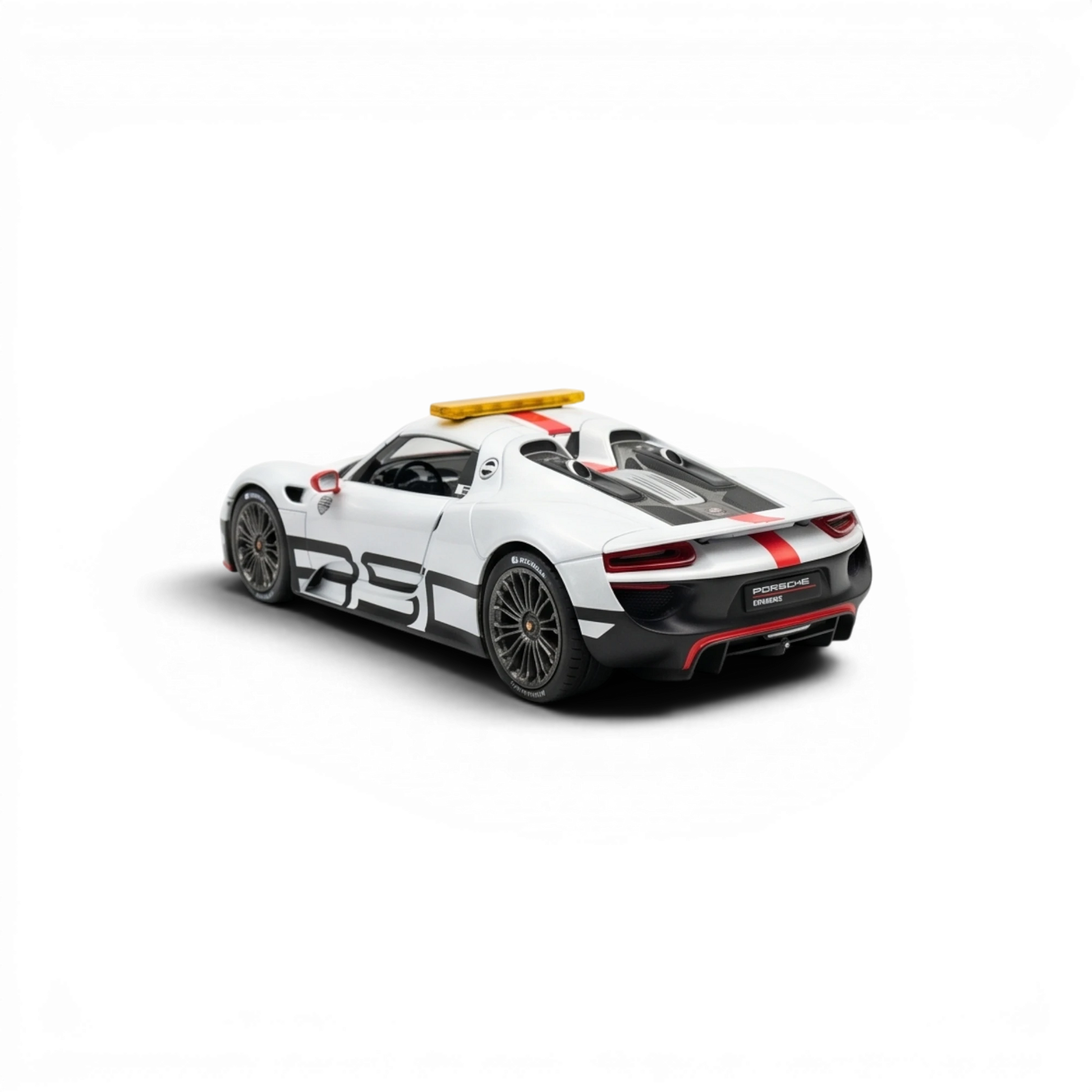 Lot57Supplies Diecast Shop 1:64 scale white Porsche 918 Spyder Le Mans Safety Car model with black racing stripes and yellow light bar.