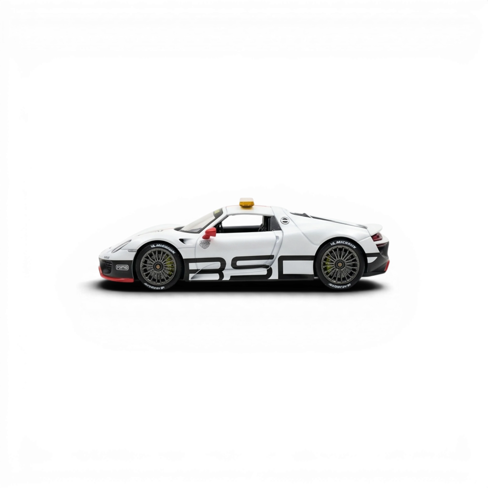 Lot57Supplies Diecast Shop 1:64 scale white Porsche 918 Spyder Le Mans Safety Car model with black racing stripes and yellow light.